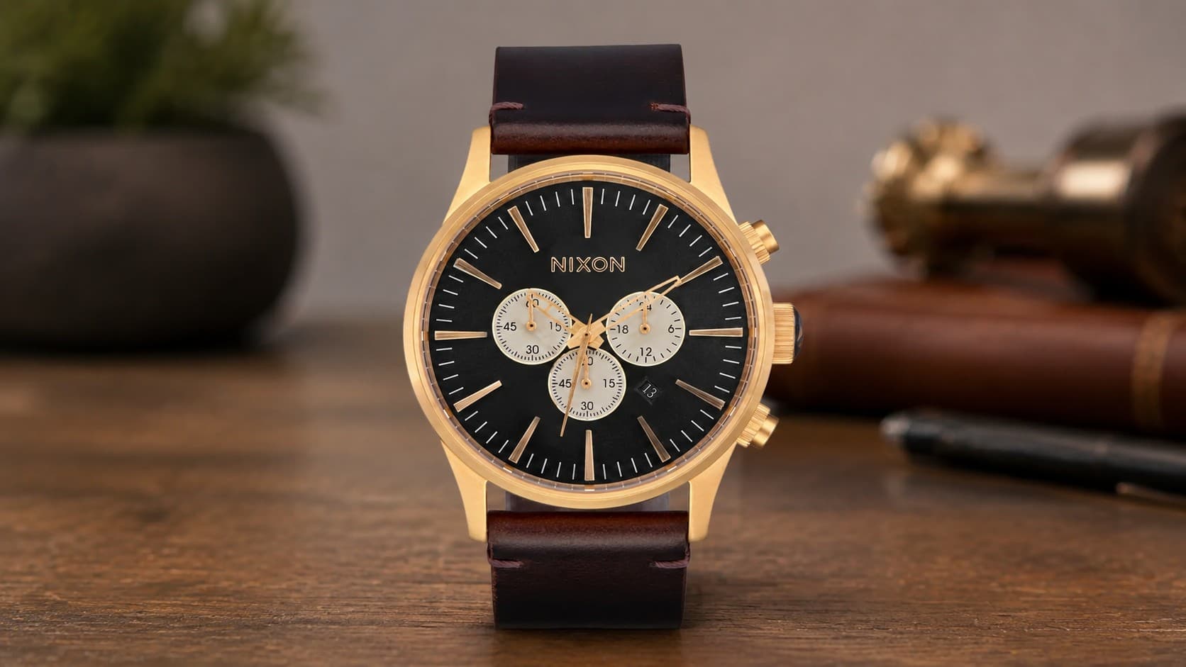 Nixon Sentry Chrono watch with black dial and brown leather strap