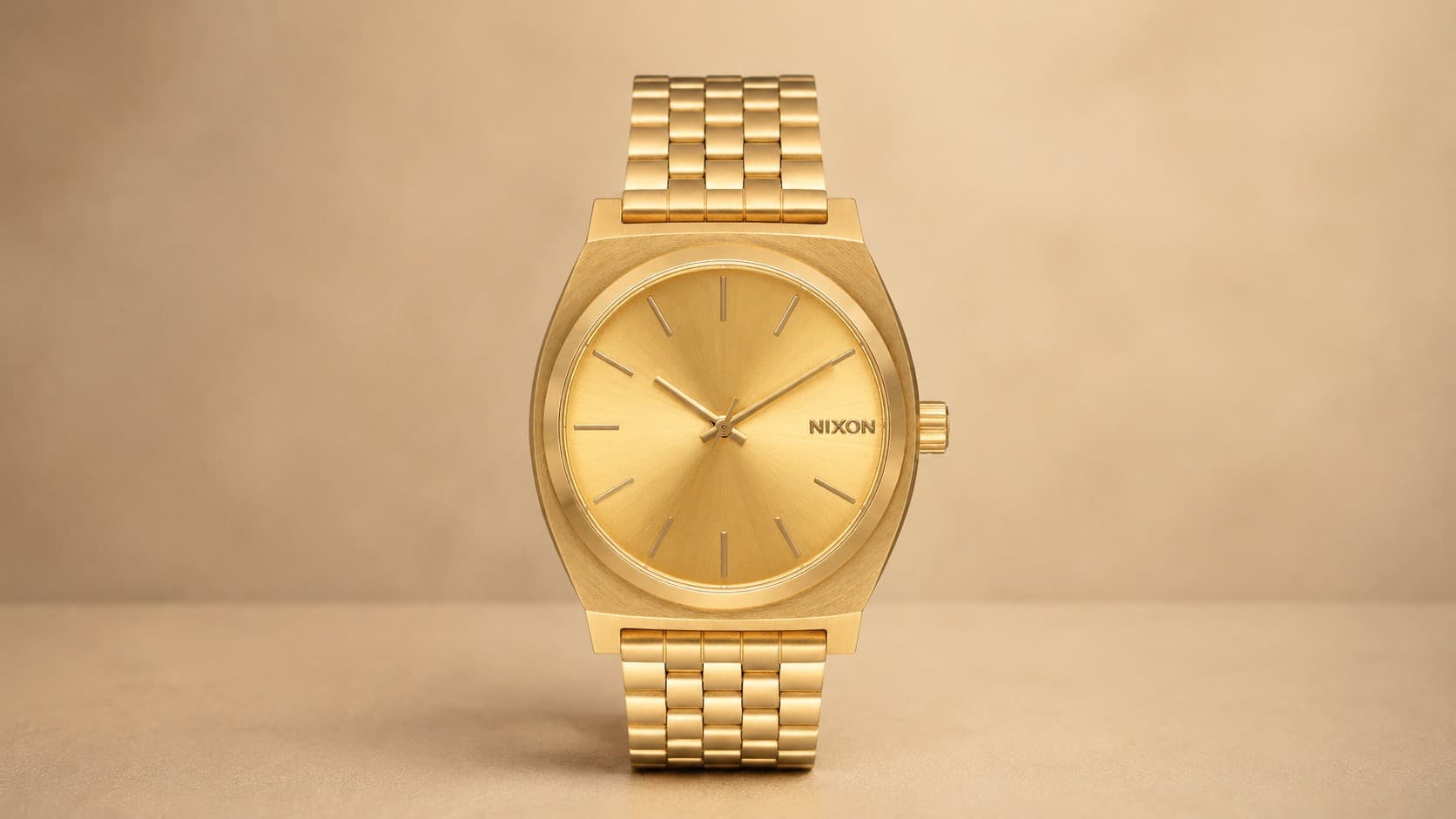 Nixon Time Teller gold watch with gold stainless steel bracelet