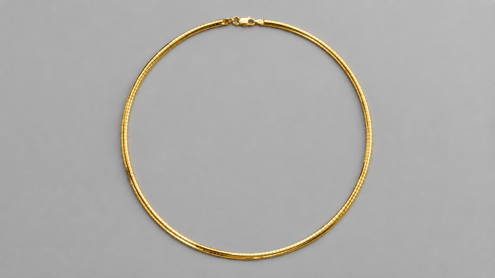 Gold omega chain necklace with a smooth collar-like design