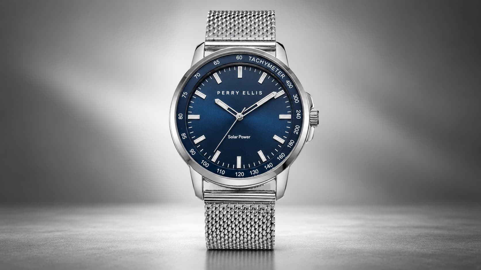 Perry Ellis Solar Powered watch with blue dial and stainless steel mesh band