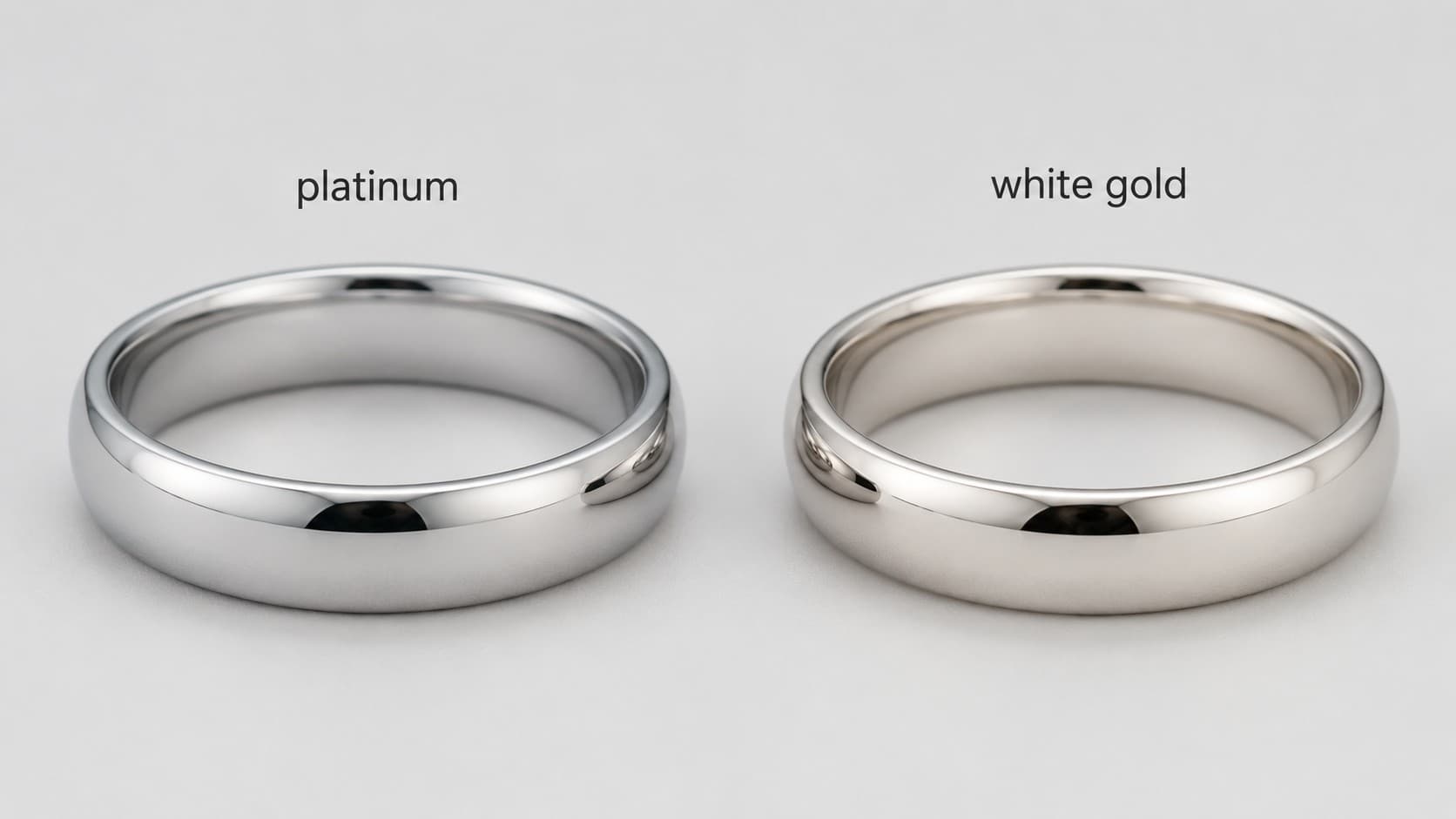 Platinum ring next to a white gold ring showing the natural color difference