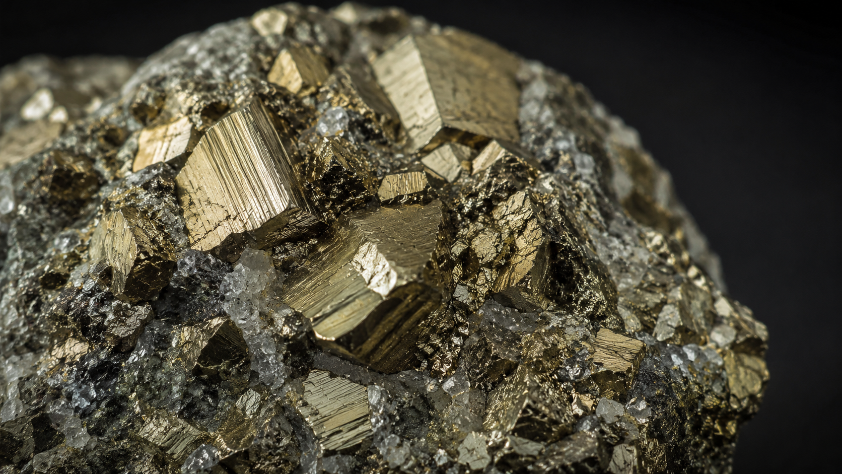 Close-up of pyrite crystal cubes showing natural metallic gold shine
