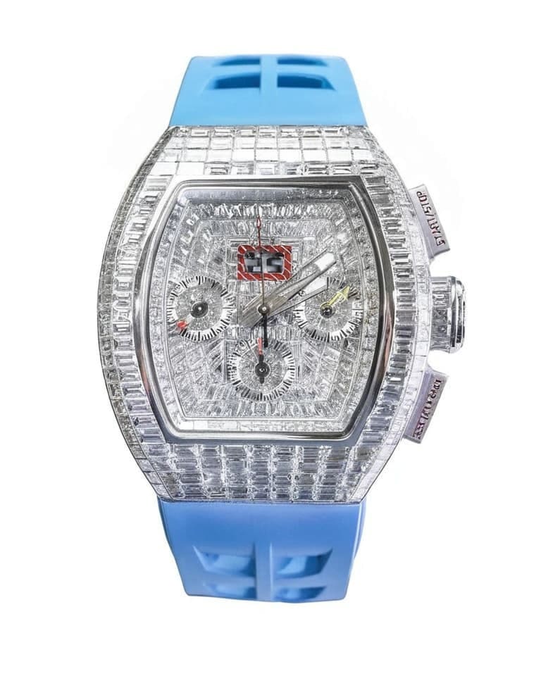 Richard Mille diamond-set luxury chronograph watch with sapphire crystal case and blue rubber strap demonstrating premium craftsmanship and materials