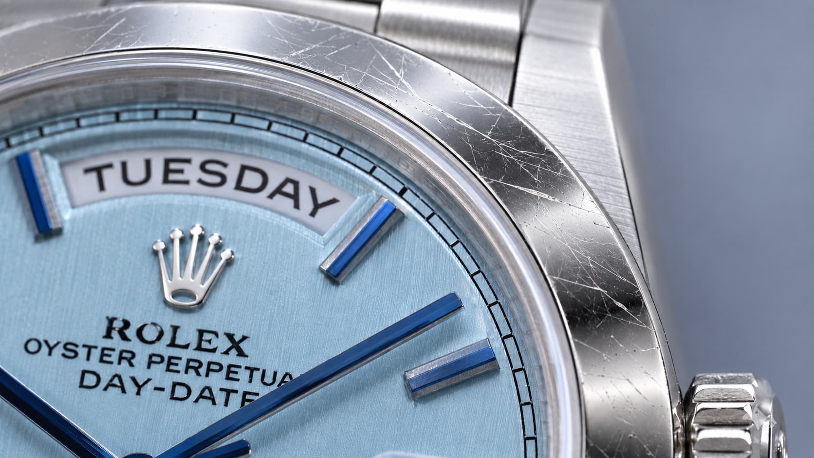 Close-up of a scratched Rolex Day-Date bezel