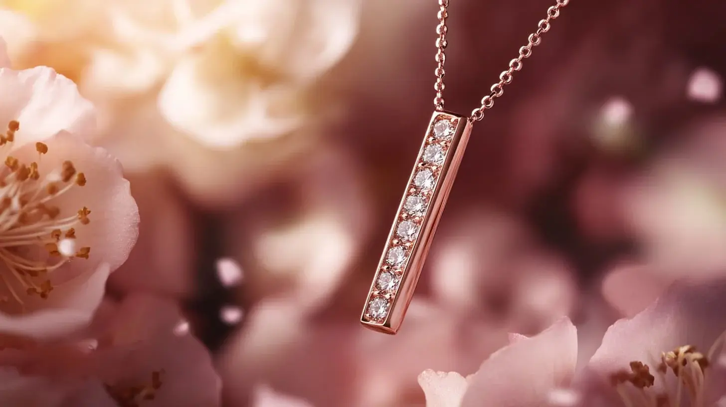 Rose gold vertical bar pendant set with a line of diamonds among pink blossoms