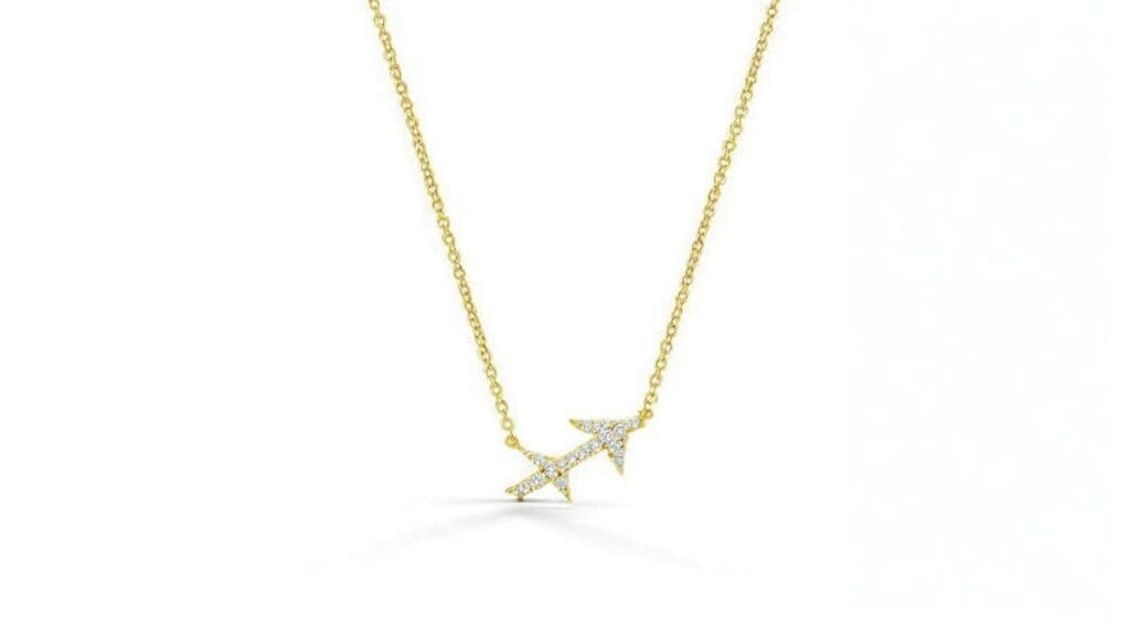 Delicate gold Sagittarius pendant necklace with diamond accents featuring the zodiac symbol