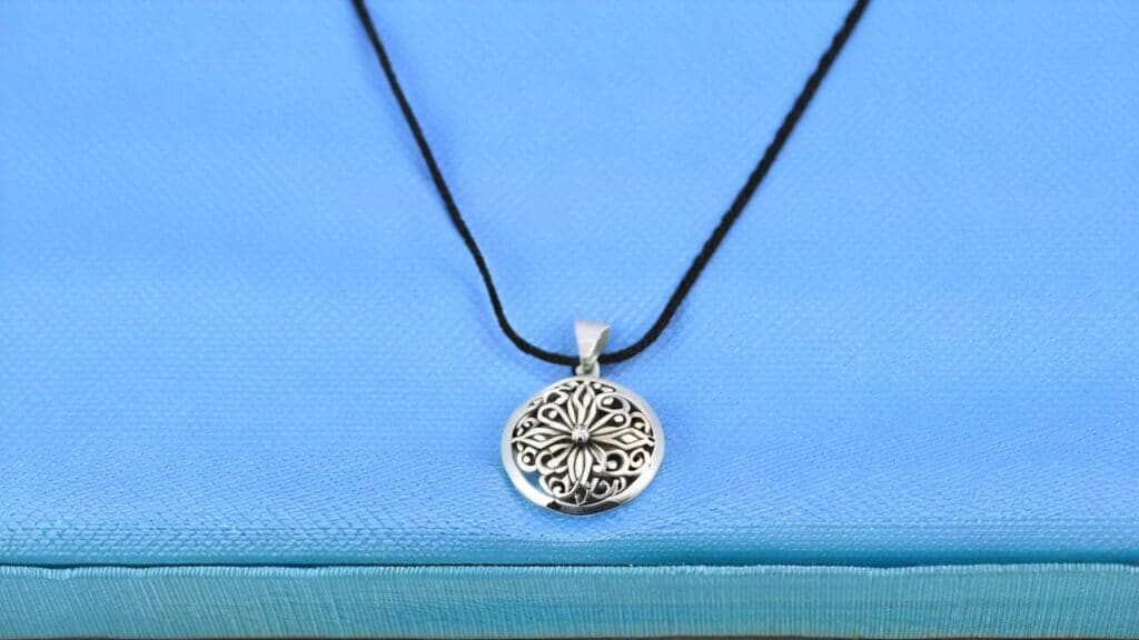 Silver pendant necklace that should never be cleaned with toothpaste to avoid scratching and damage