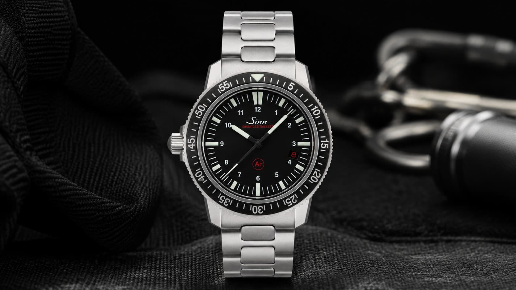 Sinn EZM 3 dive watch with black rotating bezel and steel bracelet