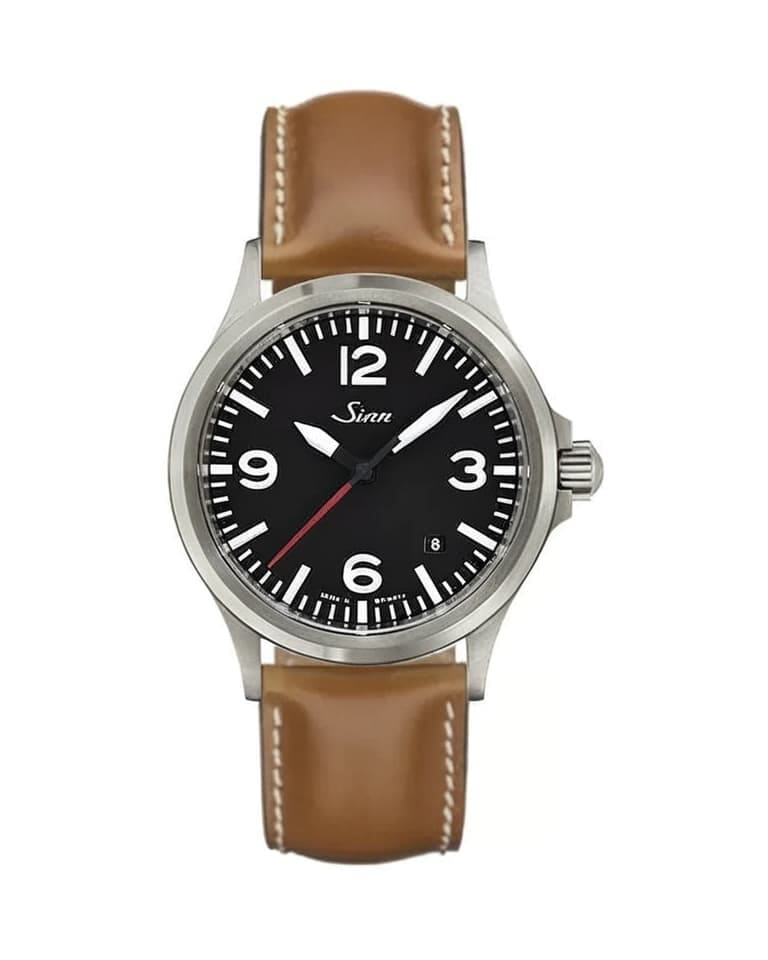 Sinn watch with black dial and brown leather strap showcasing classic German pilot watch design with Arabic numerals and red seconds hand