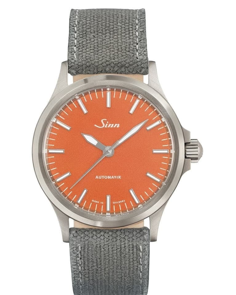 Sinn automatic with vivid orange dial, steel case and grey canvas strap