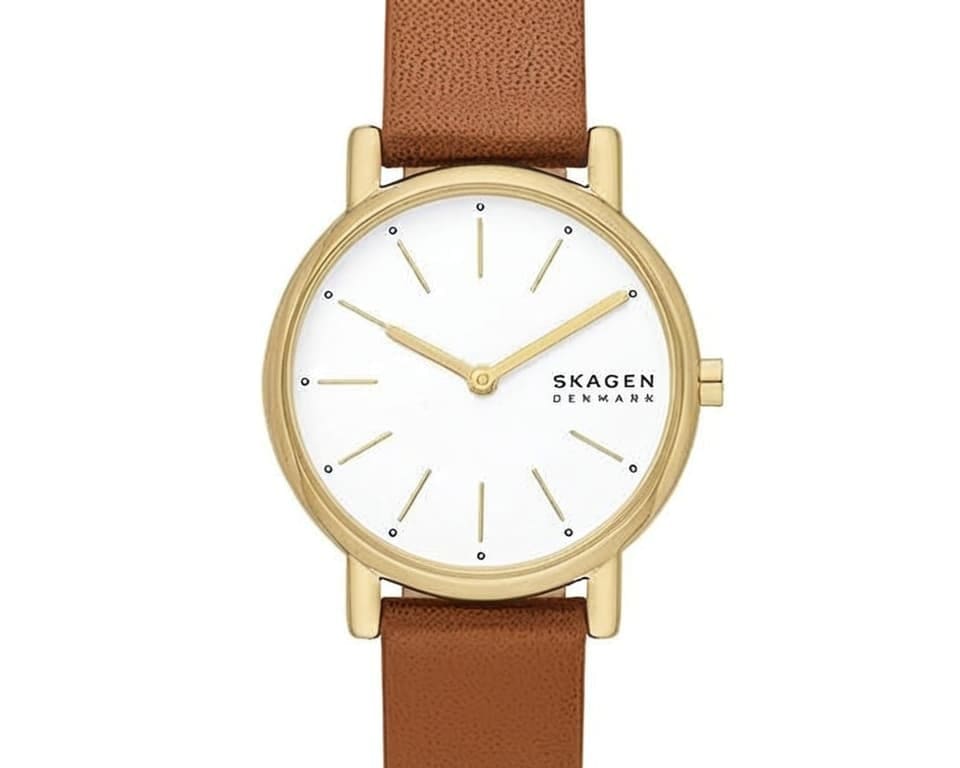 Skagen gold-toned case watch with brown textured leather strap showcasing classic Danish minimalist design and clean white dial