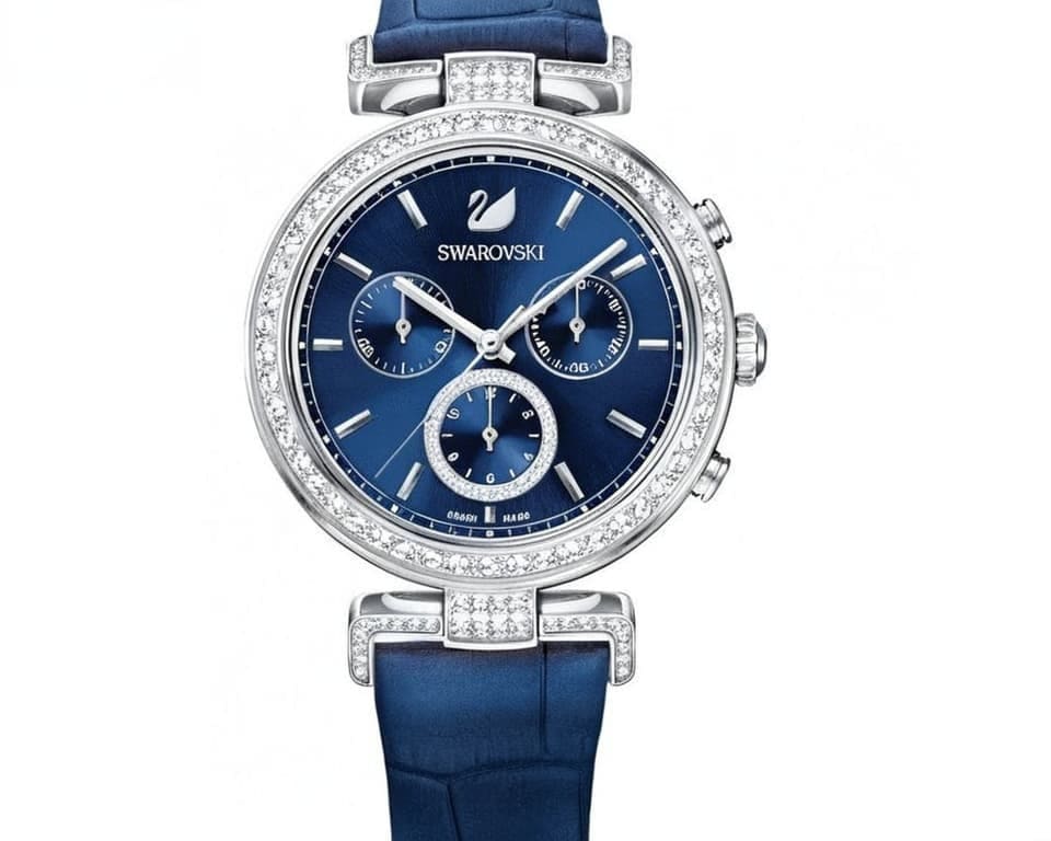 Swarovski chronograph watch with blue sunray dial, crystal-set bezel, stainless steel case, and blue leather strap featuring three subdials