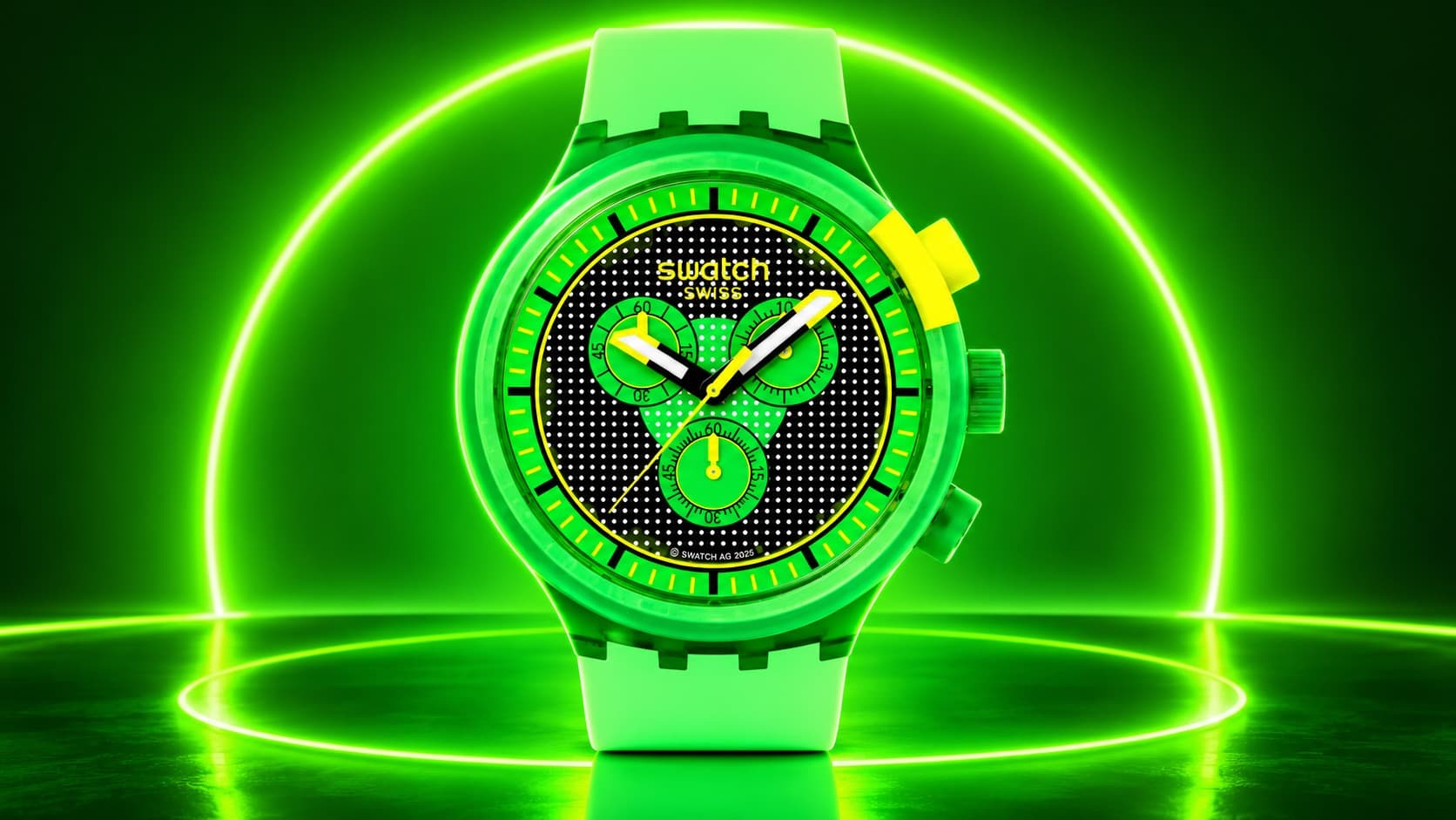 Swatch Glowingly Green chronograph watch glowing bright green against a neon backdrop