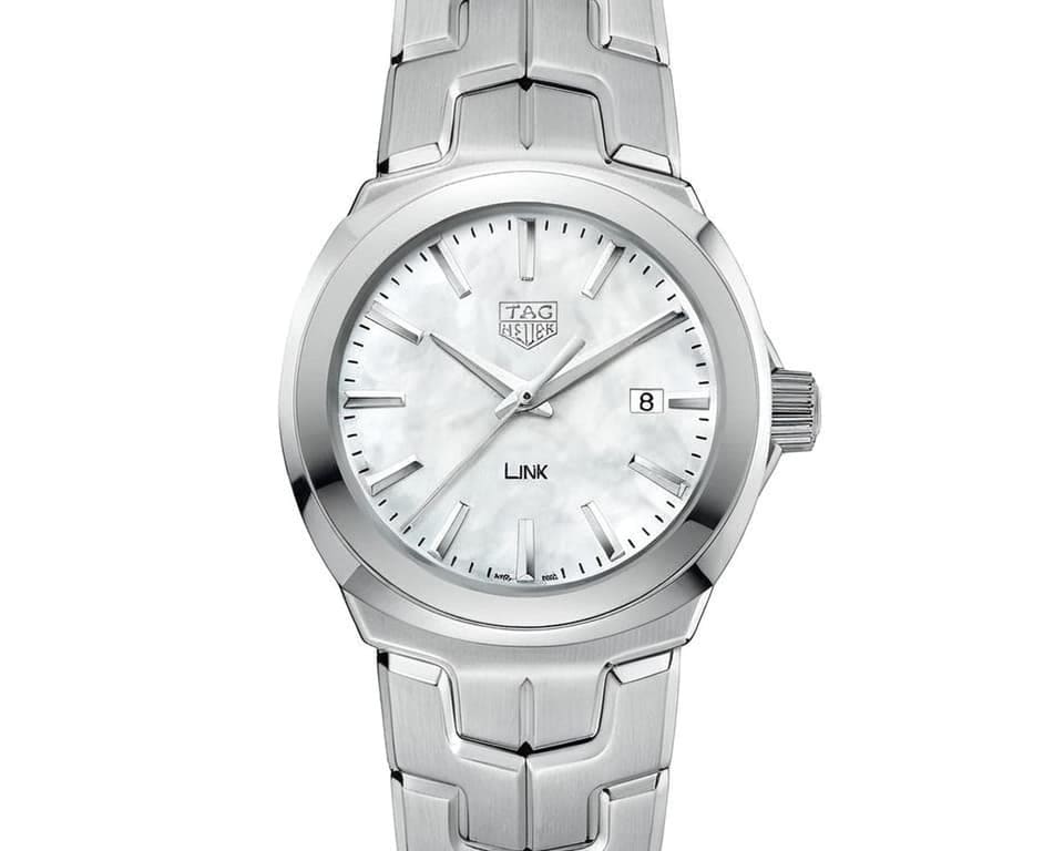 TAG Heuer Link luxury watch featuring clean silver dial, polished stainless steel case and distinctive S-shaped bracelet design, representing elegant Swiss watchmaking heritage