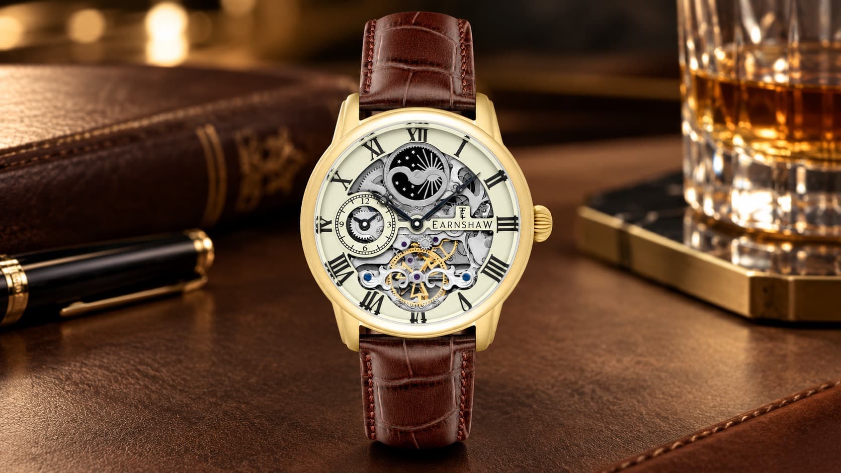 Thomas Earnshaw Longitude dual-time skeleton automatic watch in gold with a brown leather strap