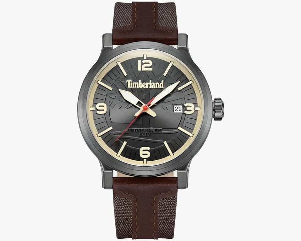 Timberland watch with gunmetal gray case and brown textile leather strap featuring textured dial and date window