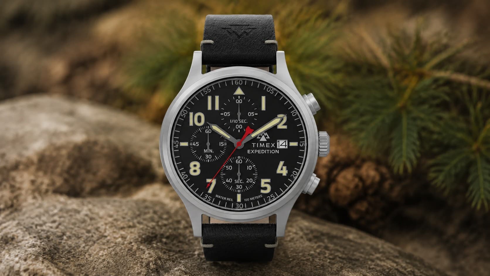 Timex Expedition Sierra Chronograph watch with a black dial and red second hand outdoors