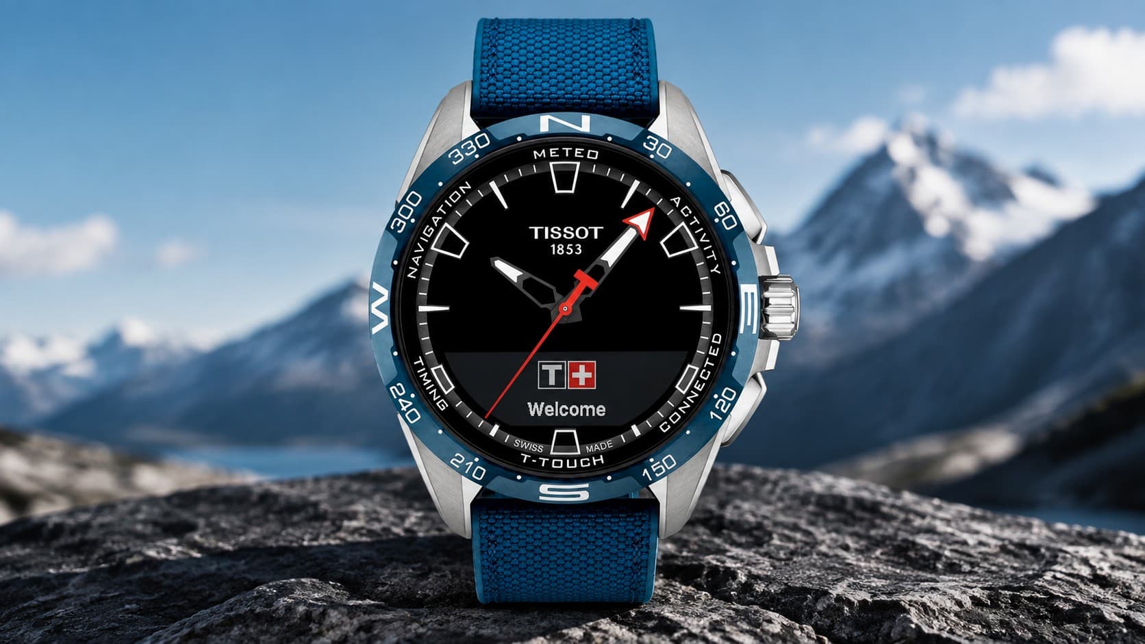 Tissot T-Touch Connect Solar 47.5mm smartwatch with blue strap on a mountain rock