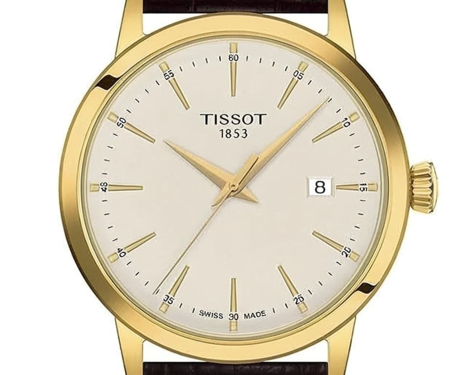 Tissot Classic Dream in gold with cream dial and brown leather strap