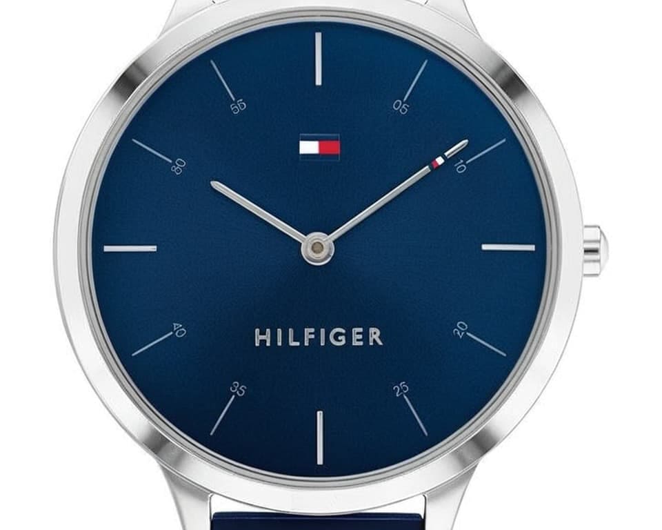 Tommy Hilfiger watch with navy blue dial, flag logo and slim silver hands