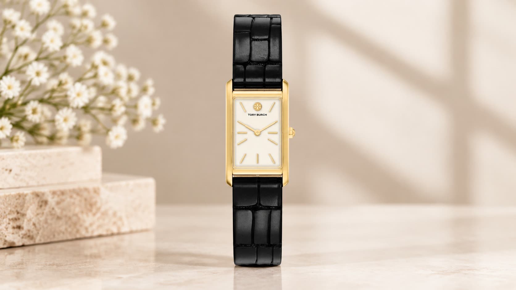 Tory Burch Slim Eleanor watch with gold rectangular case and black croc-embossed leather strap