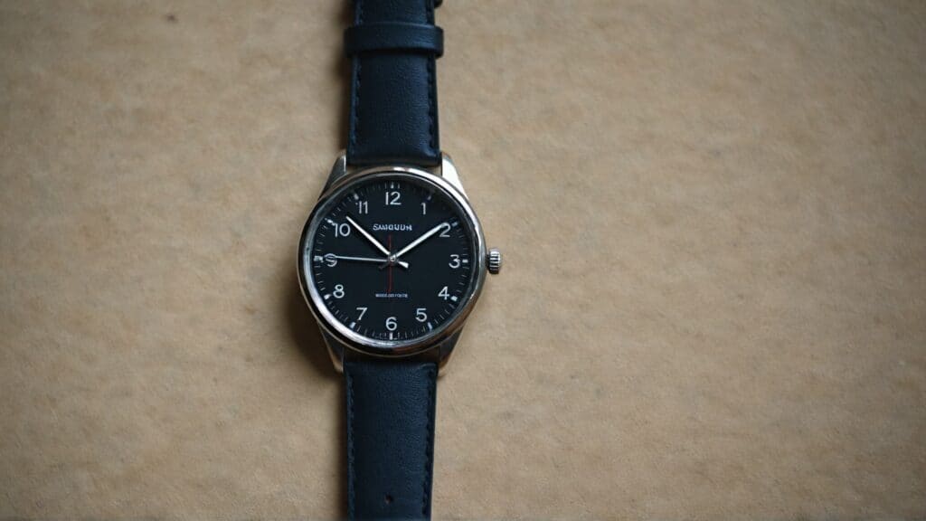 Naked watch with black dial demonstrating watch-only sale without manufacturer accessories