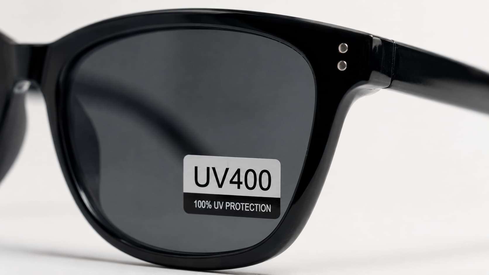 UV400 and 100% UV protection label on a sunglasses lens