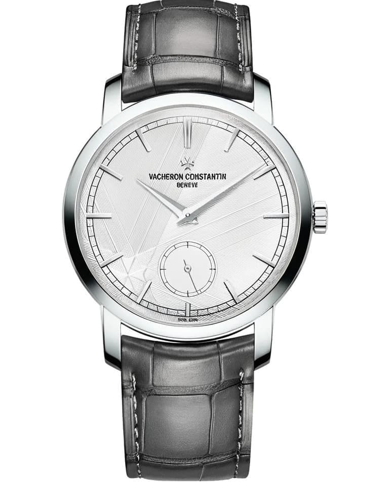 Vacheron Constantin Traditionnelle watch in white gold with silver textured dial, small seconds subdial, and black leather strap representing Swiss haute horlogerie