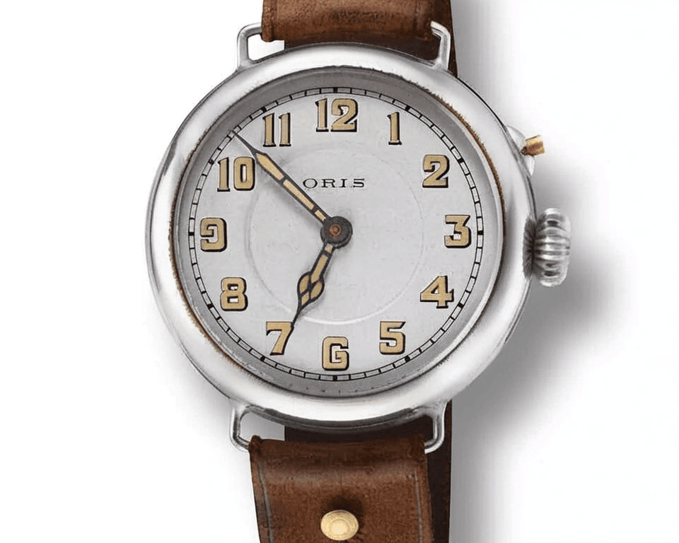 Vintage Oris aviation watch with white dial, Arabic numerals, and brown leather strap showcasing classic pilot watch design
