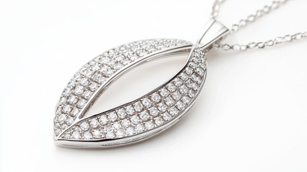 White gold pendant necklace with pavé diamonds arranged in a leaf-shaped design, highlighting elegant craftsmanship and dazzling brilliance.
