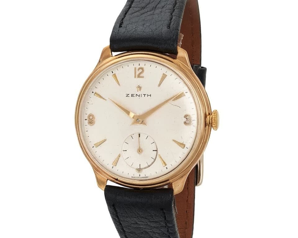 Vintage Zenith watch with rose gold case, cream dial, and black leather strap showcasing the brand's classic timepiece design and heritage craftsmanship