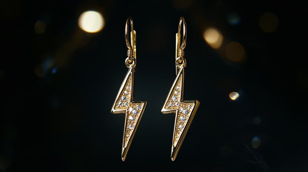 Pair of gold lightning bolt earrings adorned with gemstones, representing creativity and dynamic energy in jewelry.