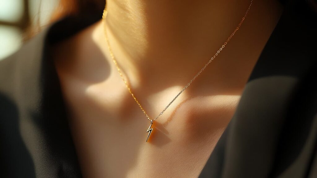 Gold lightning bolt pendant necklace worn by a woman, representing personal power and subtle elegance.