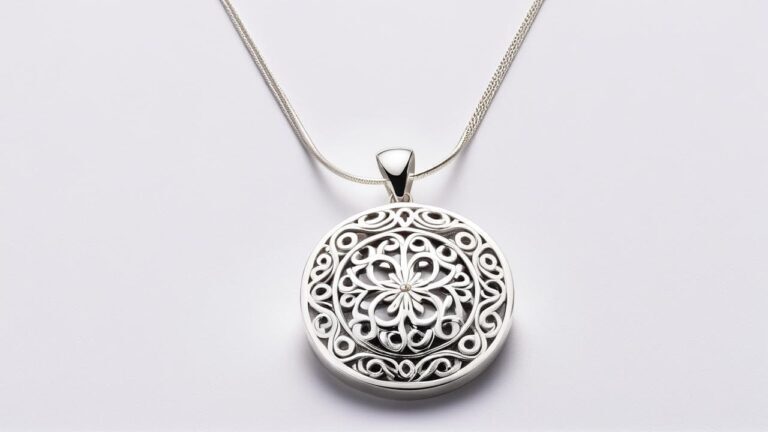 Ornate circular 900 silver pendant featuring intricate floral filigree design, showcasing craftsmanship and purity of 90% silver content.