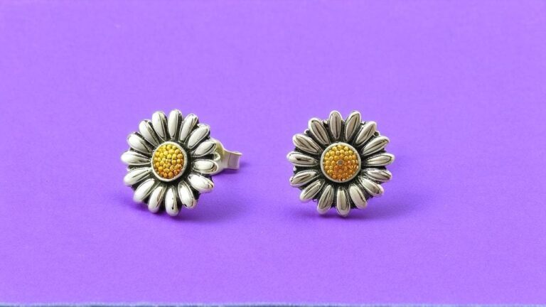 Sterling silver daisy stud earrings with detailed petals and textured yellow centers on purple background