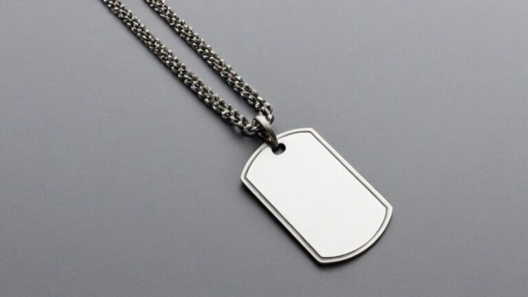 Silver fashion dog tag necklace with blank surface for personalization, worn on fine snake chain for everyday accessory style