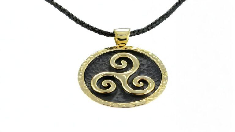 Gold triskelion pendant with three spiral arms on textured black background, hung on leather cord necklace