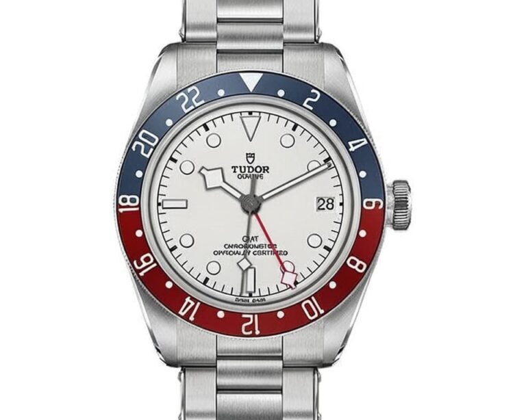 Tudor GMT watch featuring white dial, red and blue bidirectional bezel, GMT hand, and steel bracelet showcasing Swiss luxury watchmaking excellence
