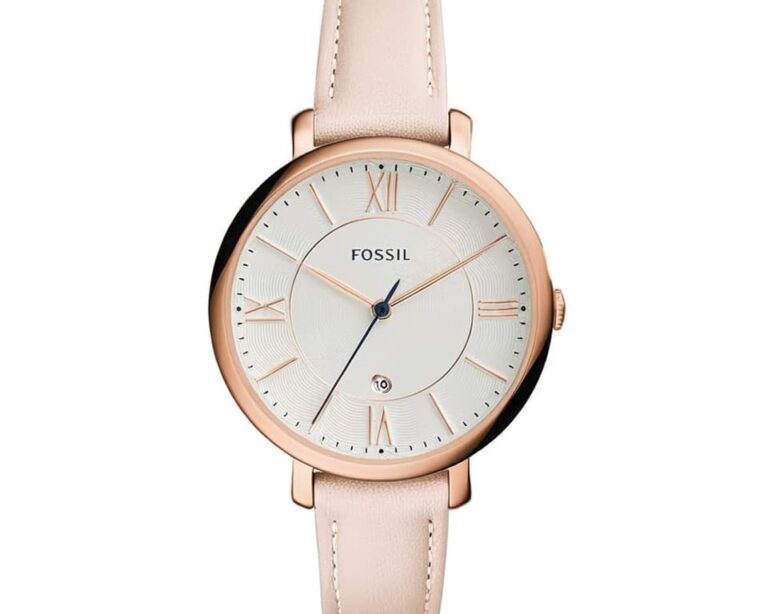 Elegant Fossil women's watch with rose gold case, cream leather strap, and Roman numeral markers showcasing classic feminine design