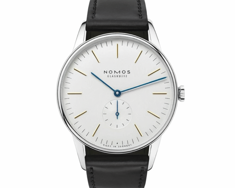 Nomos Glashütte Orion watch showcasing minimalist German design with clean silver dial, gold hour markers, blue steel hands and premium black leather strap