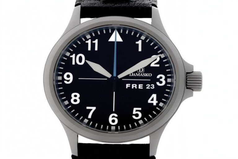 Damasko pilot watch with black dial, white luminous markers, and ice-hardened steel case showing day-date display