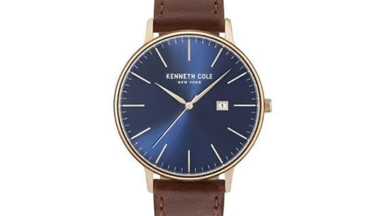 Kenneth Cole dress watch featuring blue dial with brown leather strap and gold tone case