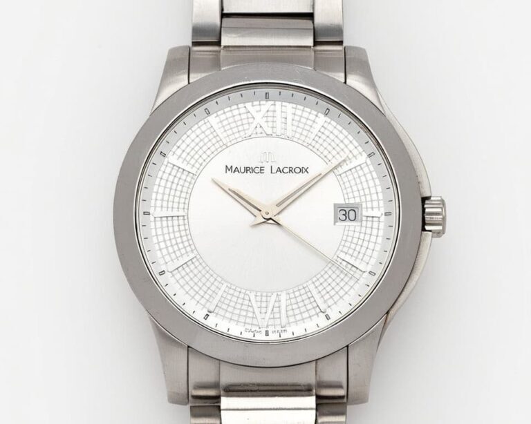 Maurice Lacroix Aikon watch featuring white dial with crosshatch pattern, Roman numerals, date window at 3 o'clock, and brushed stainless steel bracelet