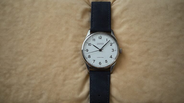 Naked watch sold without original box or papers showing timepiece only on leather strap