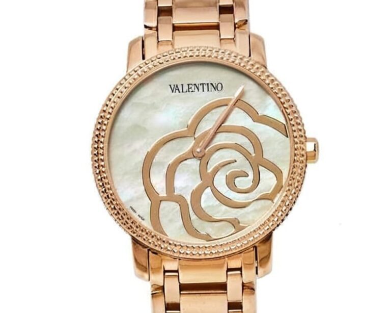 Valentino rose gold watch with mother-of-pearl dial featuring decorative rose pattern, textured bezel, and matching rose gold bracelet